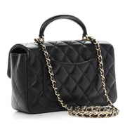 CHANEL Lambskin Quilted Mini Top Handle Rectangular Flap in Black